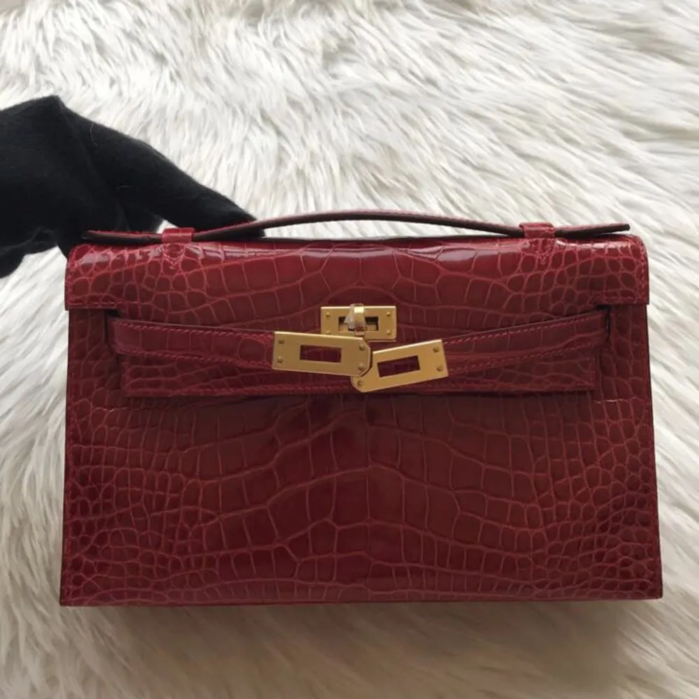 Hermès Kelly Pochette Braise Crocodile Niloticus Lisse Gold Hardware GHW