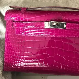 Hermès Kelly Pochette Rose Sheherazade Alligator Mississippi Lisse Palladium Hardware PHW