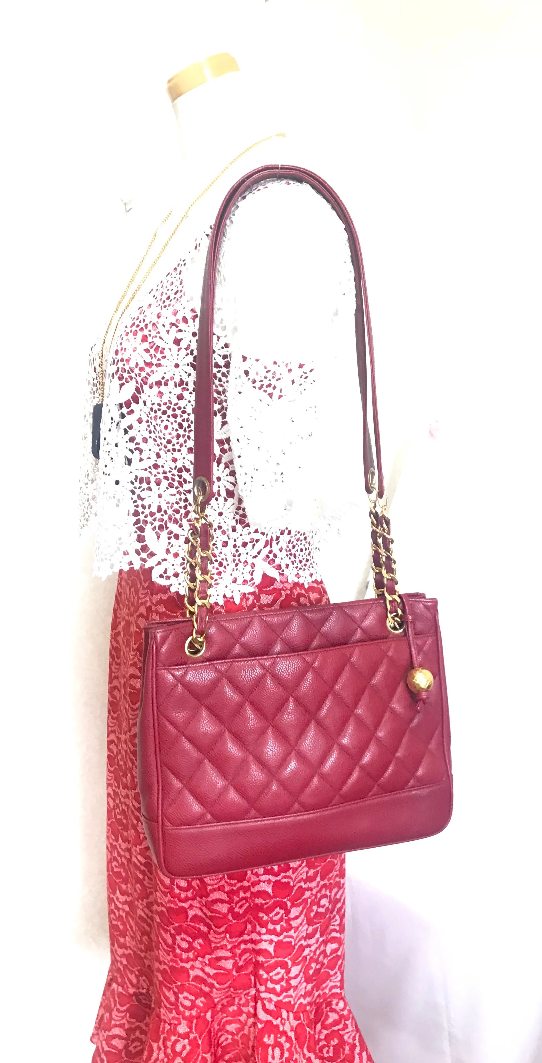 Vintage CHANEL cherry red caviar leather quilted shoulder bag, tote with golden CC ball and chain straps. Classic bag.