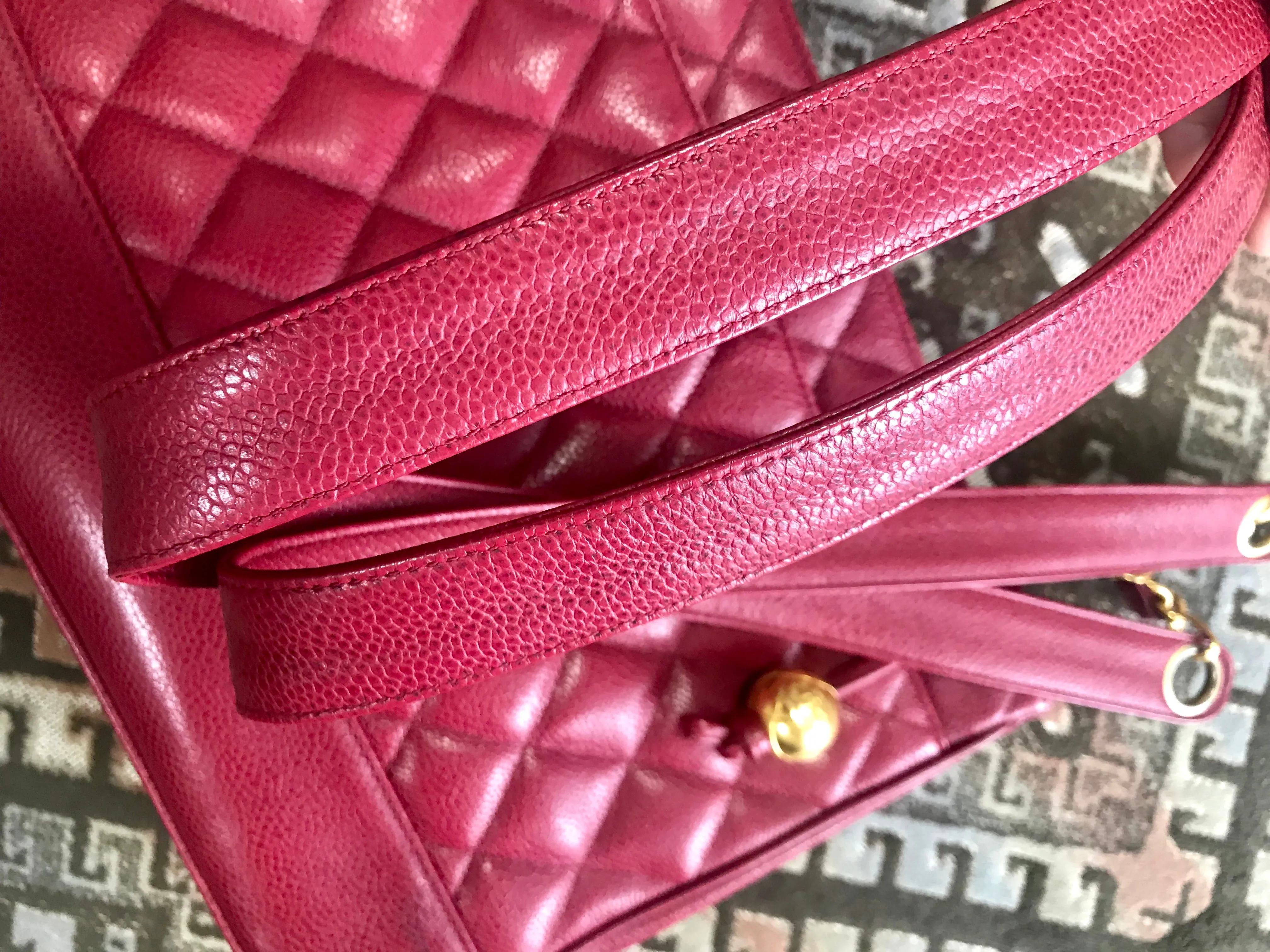 Vintage CHANEL cherry red caviar leather quilted shoulder bag, tote with golden CC ball and chain straps. Classic bag.