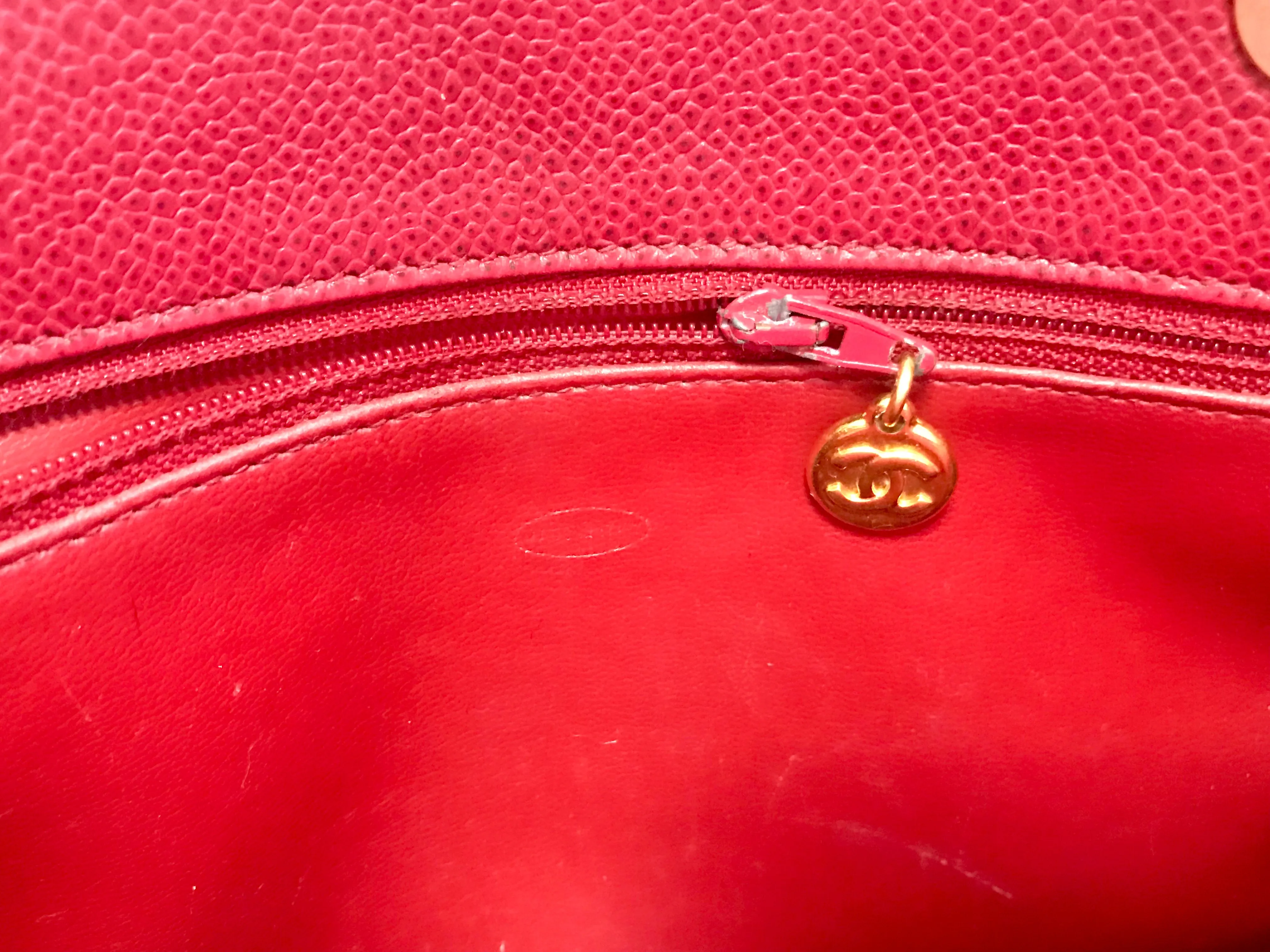Vintage CHANEL cherry red caviar leather quilted shoulder bag, tote with golden CC ball and chain straps. Classic bag.